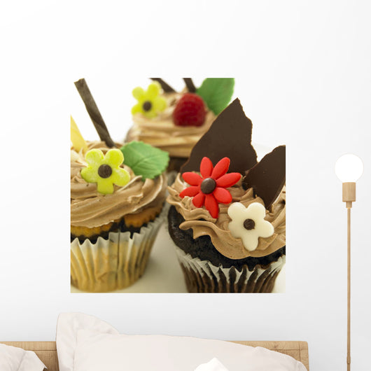 Close-Up Of Three Chocolate Cupcakes With Candy Flowers Wall Mural