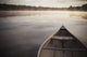Canoe In Morning Fog On Duck Lake Wall Mural