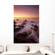 California, Malibu, Sunset over rocky ocean coastline Wall Mural
