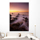 California, Malibu, Sunset over rocky ocean coastline Wall Mural