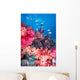 Diver in background of colorful soft coral reef scene with anthias Wall Mural