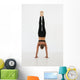 A woman doing a handstand Wall Mural
