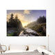 A Hiker Stands By Brook As Sunrise Burns Through The Mist Wall Mural