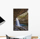 A River Cascades Over A Small Waterfall Wall Mural
