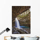 A River Cascades Over A Small Waterfall Wall Mural