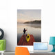 Man Standing By Kayak On Dock In Northwestern Ontario Wall Mural