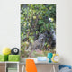 View Of A Wild Canada Lynx Sitting Beneath An Alder Tree Wall Mural