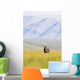 A Solitary Musk Ox Wanders Through The Grass Wall Mural