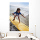 A young girl on a yellow surfboard;Gold coast queensland australia Wall Mural