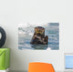A Sea Otter Swimming Amongst Sea Ice In Harriman Fjord Wall Mural