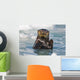 A Sea Otter Swimming Amongst Sea Ice In Harriman Fjord Wall Mural