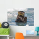 A Sea Otter Swimming Amongst Sea Ice In Harriman Fjord Wall Mural