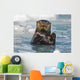 A Sea Otter Swimming Amongst Sea Ice In Harriman Fjord Wall Mural