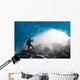 A Hiker Takes Photo Of The Entrance Of An Ice Cave Wall Mural