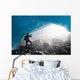 A Hiker Takes Photo Of The Entrance Of An Ice Cave Wall Mural