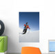Man Backcountry Snowshoeing While Carrying A Snowboard Wall Mural