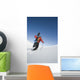 Man Backcountry Snowshoeing While Carrying A Snowboard Wall Mural