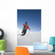 Man Backcountry Snowshoeing While Carrying A Snowboard Wall Mural