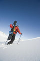 Man Backcountry Snowshoeing While Carrying A Snowboard Wall Mural