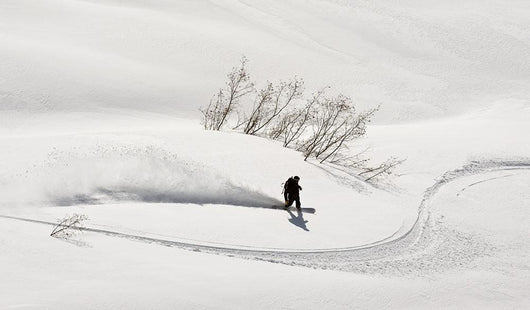 A Backcountry Snowboarder Carving In Turnagain Pass Wall Mural