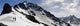 A Backcountry Snowboarder And Skier Hike Wall Mural