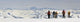 A Snowboarder And Skiers Hike Wall Mural