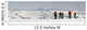 A Snowboarder And Skiers Hike Wall Mural