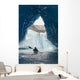 Sea Kayaker Paddles Through An Ice Cave Amongst Giant Icebergs Wall Mural