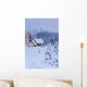 Snowcovered Home In A Wintry Meadow At Dawn With Inside Lights On Wall Mural