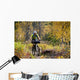 Man Mountain Biking With Dog Running Beside Him Wall Mural