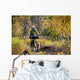 Man Mountain Biking With Dog Running Beside Him Wall Mural