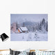Snowcovered Home In A Wintry Meadow At Dawn With Inside Lights On Wall Mural