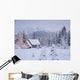 Snowcovered Home In A Wintry Meadow At Dawn With Inside Lights On Wall Mural