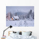 Snowcovered Home In A Wintry Meadow At Dawn With Inside Lights On Wall Mural