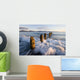 Surf Rushing Around Old Pilings Wall Mural