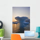 Sunset Beyond Ice Sculpture Of A Whales Tail Wall Mural