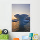 Sunset Beyond Ice Sculpture Of A Whales Tail Wall Mural