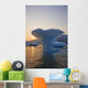 Sunset Beyond Ice Sculpture Of A Whales Tail Wall Mural