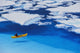 Female Kayaker Navigates Through A Melt Pond In The Juneau /Nicefield Wall Mural