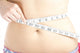 Woman Measuring Her Belly Wall Mural