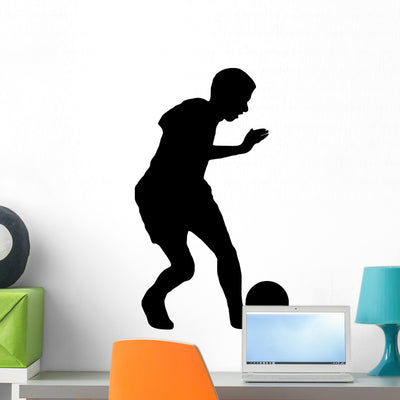 Soccer Boy with Ball Wall Decal shown on a wall