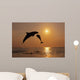 Pair Of Bottle Nose Dolphins Jumping At Sunset Wall Mural