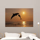 Pair Of Bottle Nose Dolphins Jumping At Sunset Wall Mural