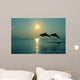 Pair Of Bottle Nose Dolphins Jumping At Sunset Wall Mural
