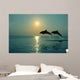 Pair Of Bottle Nose Dolphins Jumping At Sunset Wall Mural