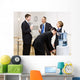 Business people drinking water at water cooler Wall Mural
