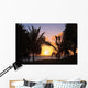 Hawaii, Oahu, Kailua, Lanikai, Vibrant sunset with a couple on beach Wall Mural