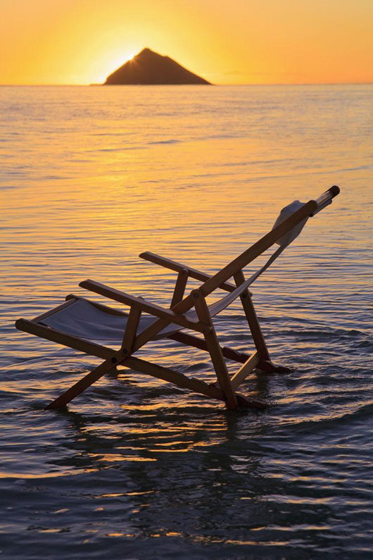 Hawaii, Lanikai, Empty beach chair at sunset Wall Mural