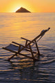 Hawaii, Lanikai, Empty beach chair at sunset Wall Mural