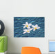Plumeria flowers floating in clear blue water Wall Mural
